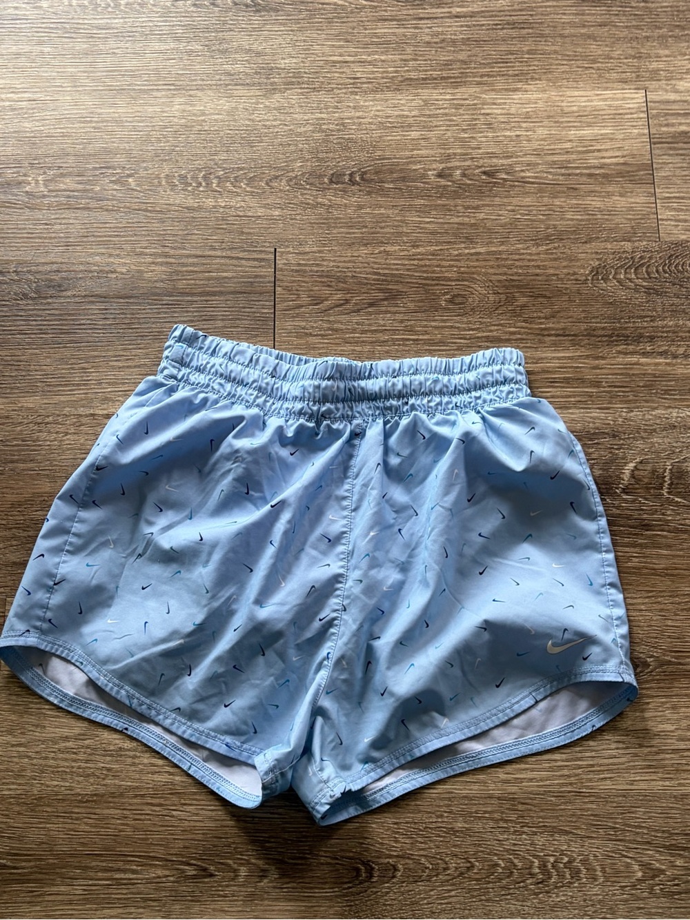 Nike Light Blue Girls Athletic Shorts with Micro Swoosh Pattern